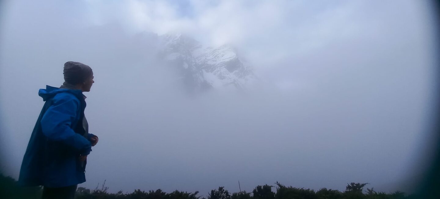 A visitor views Manaslu from inside a cloud